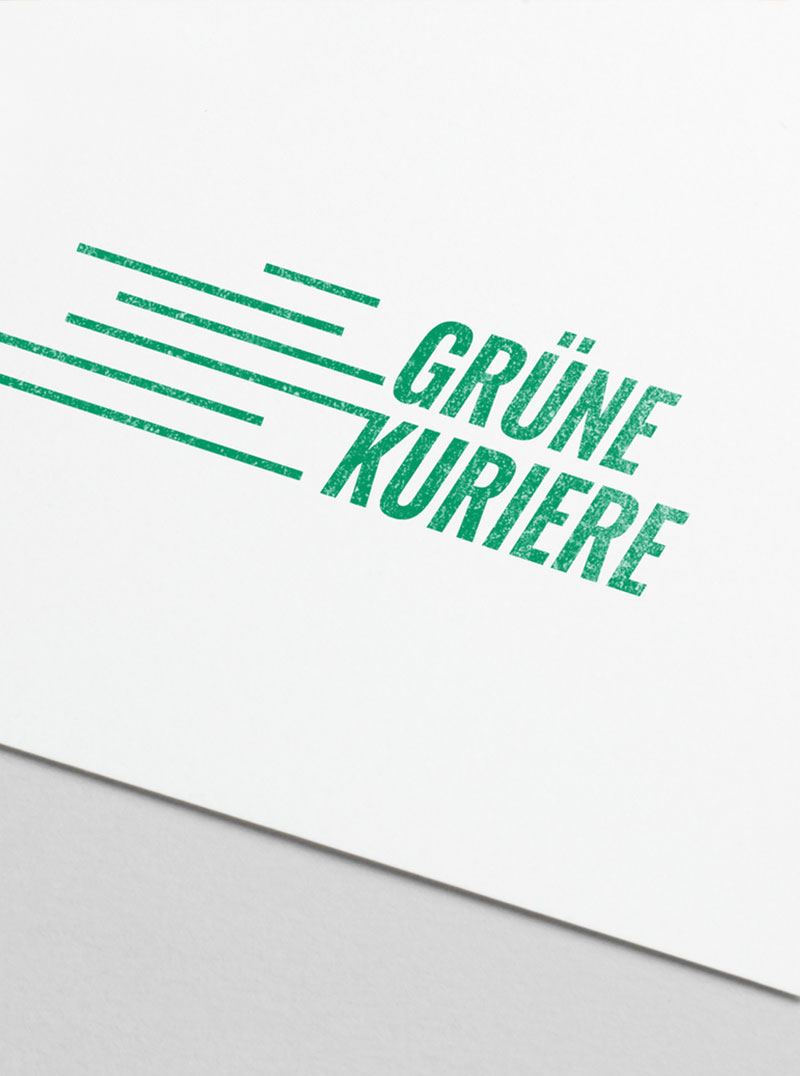 Das Logo der Grünen Kuriere auf Papier gestempelt