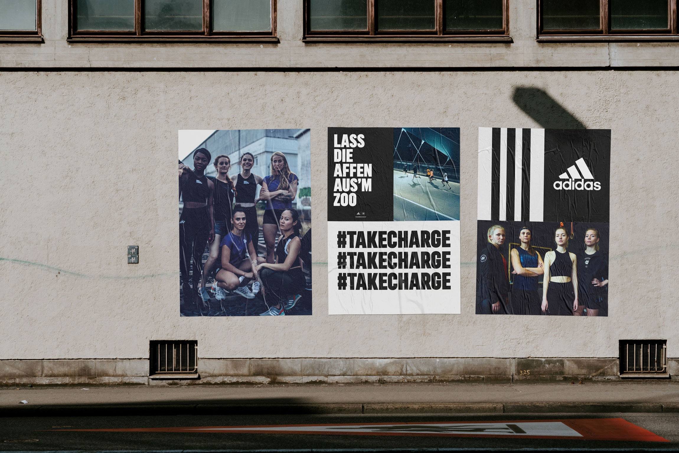 Posterdesign f&uuml;r die adidas Runners Frankfurt an einer Wand mit plakativer Typografie und Bildern