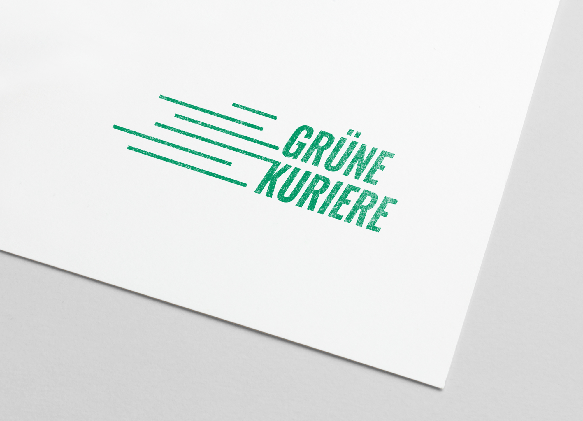 Das Logo der Gr&uuml;nen Kuriere auf Papier gestempelt